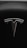 A sleek metallic emblem resembling a stylized letter 'T' is set against a textured black background, suggesting a modern and minimalist design aesthetic.