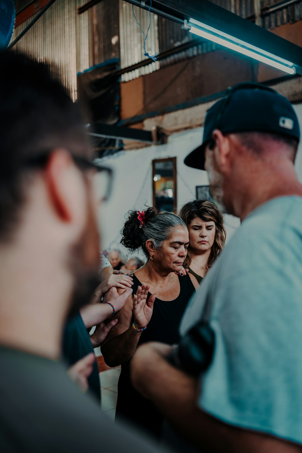 a group of people standing around each other