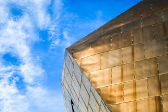 Close-up of a golden architectural detail on a modern facade.