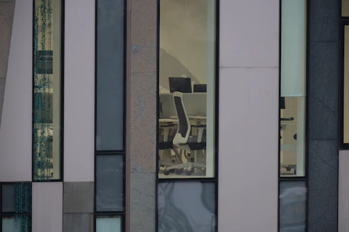 Modern office building with Chilean almonds displayed prominently on a desk.