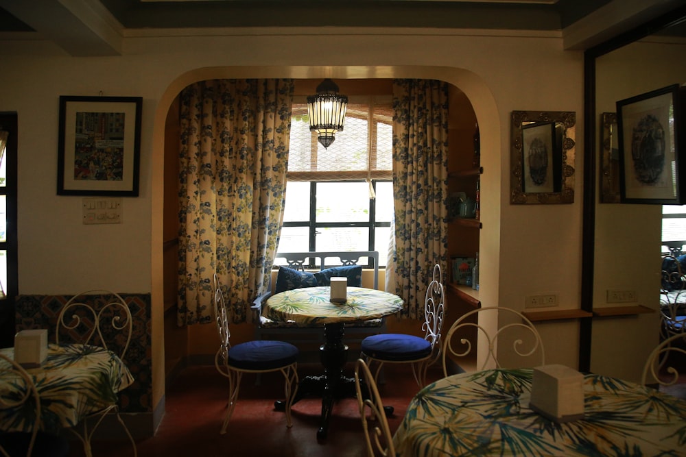 a dining room with a table and chairs