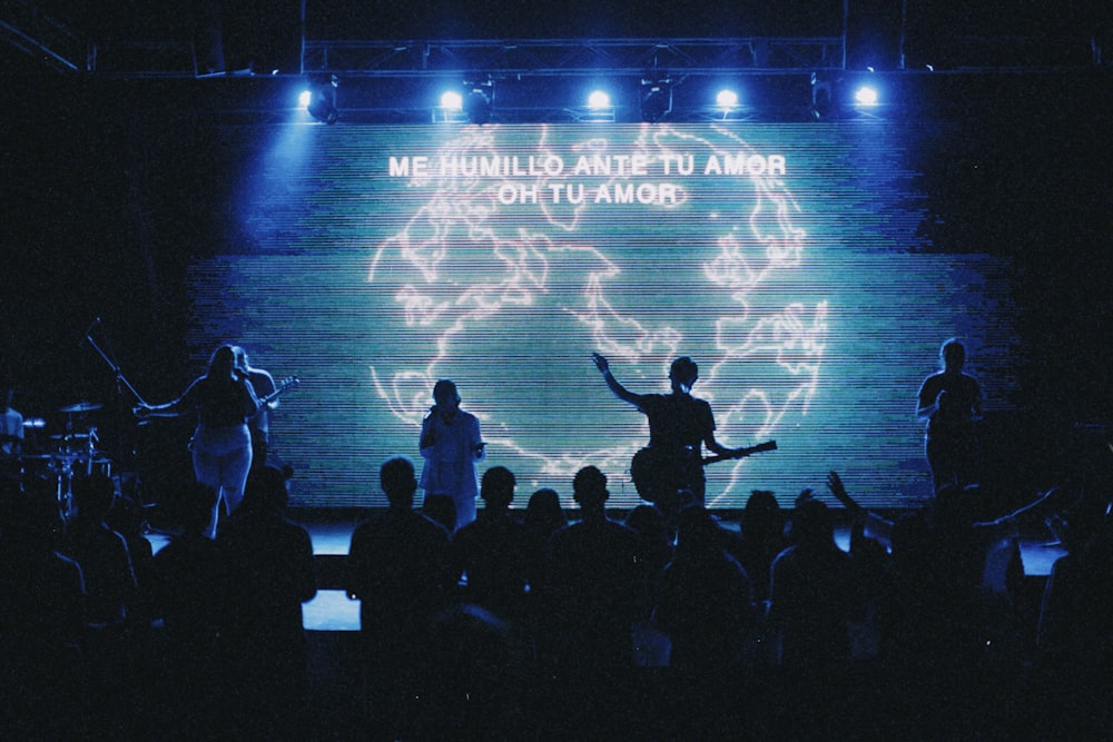 a group of people standing on top of a stage