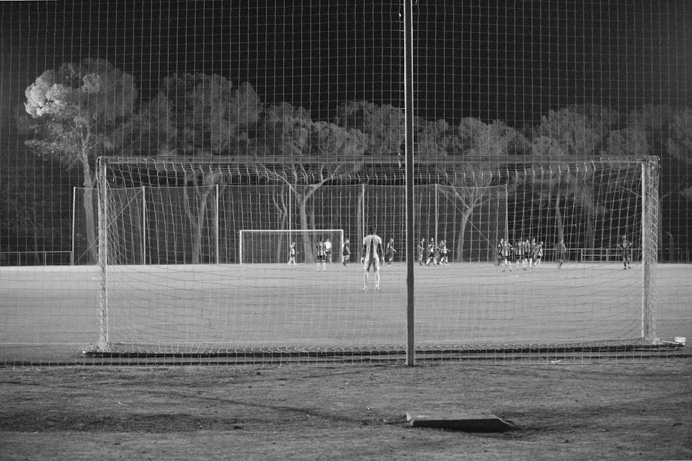 a black and white photo of a soccer field