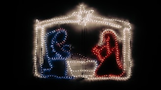 Close-up of a finished coloring page showing the nativity scene with warm, glowing colors.