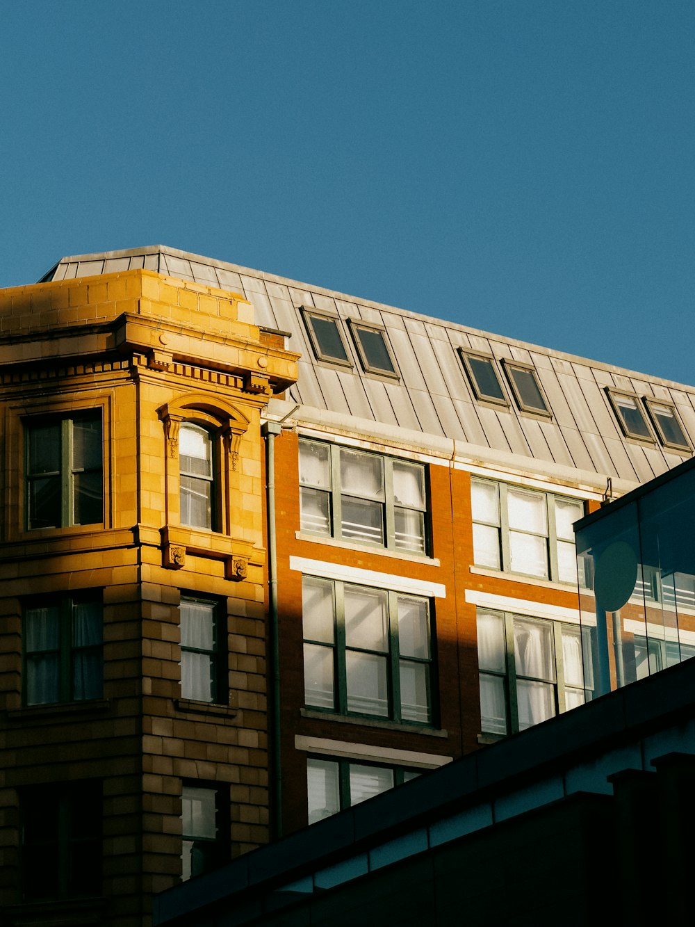 a tall building with a clock on the top of it