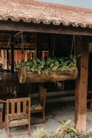 a wooden table topped with lots of green vegetables