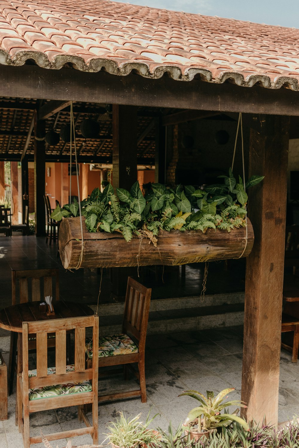 a wooden table topped with lots of green vegetables