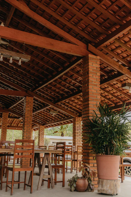 Cozy outdoor seating area with traditional Portuguese tiles and wooden beams