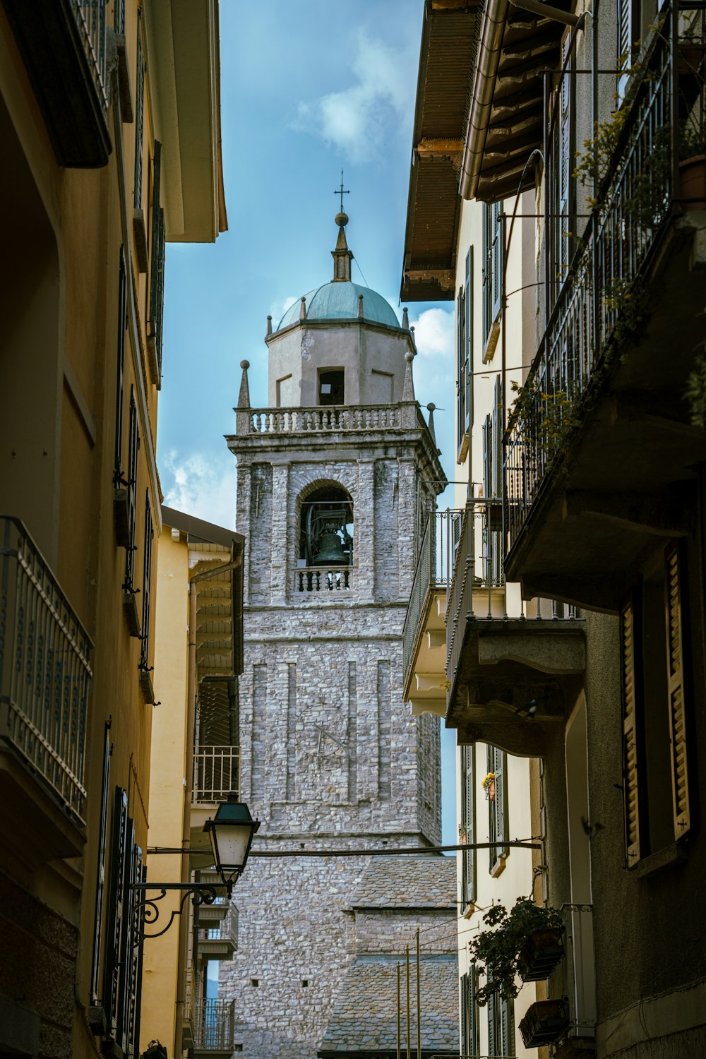 a tall clock tower towering over a city street