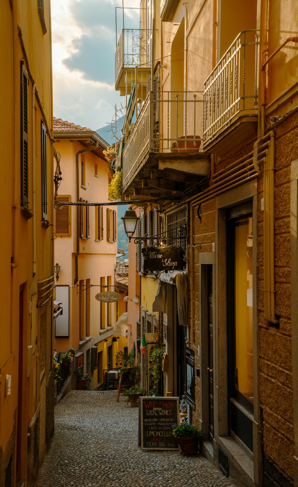 a narrow street with a few buildings on both sides