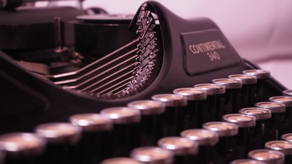 a close up of an old fashioned typewriter