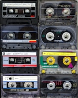 a collection of cassette tapes stacked on top of each other