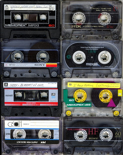 a collection of cassette tapes stacked on top of each other