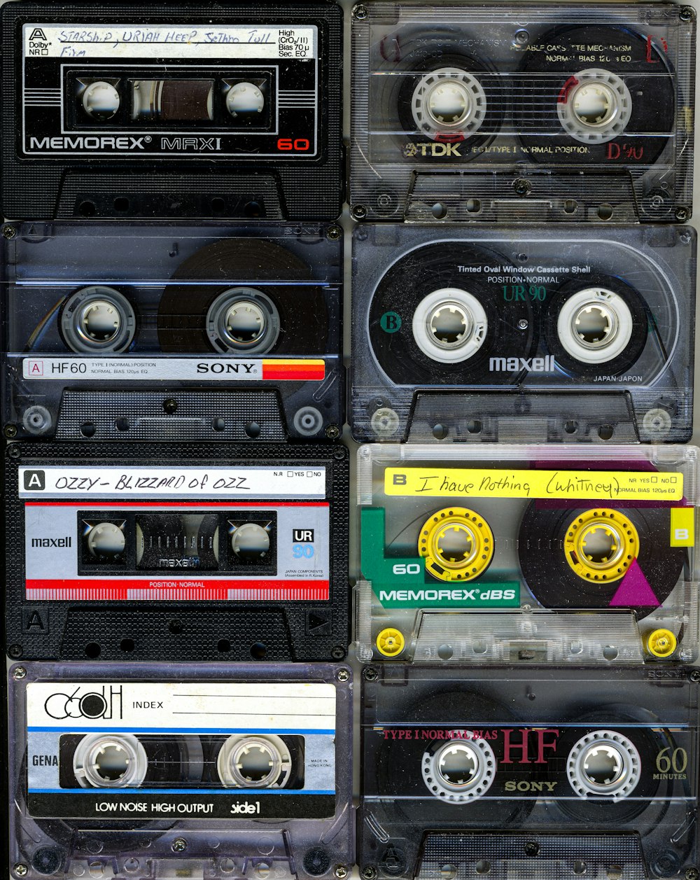 a collection of cassette tapes stacked on top of each other
