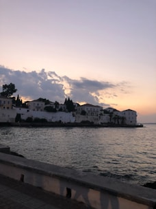 A serene Asian coastal village at sunset, symbolizing peaceful retirement.