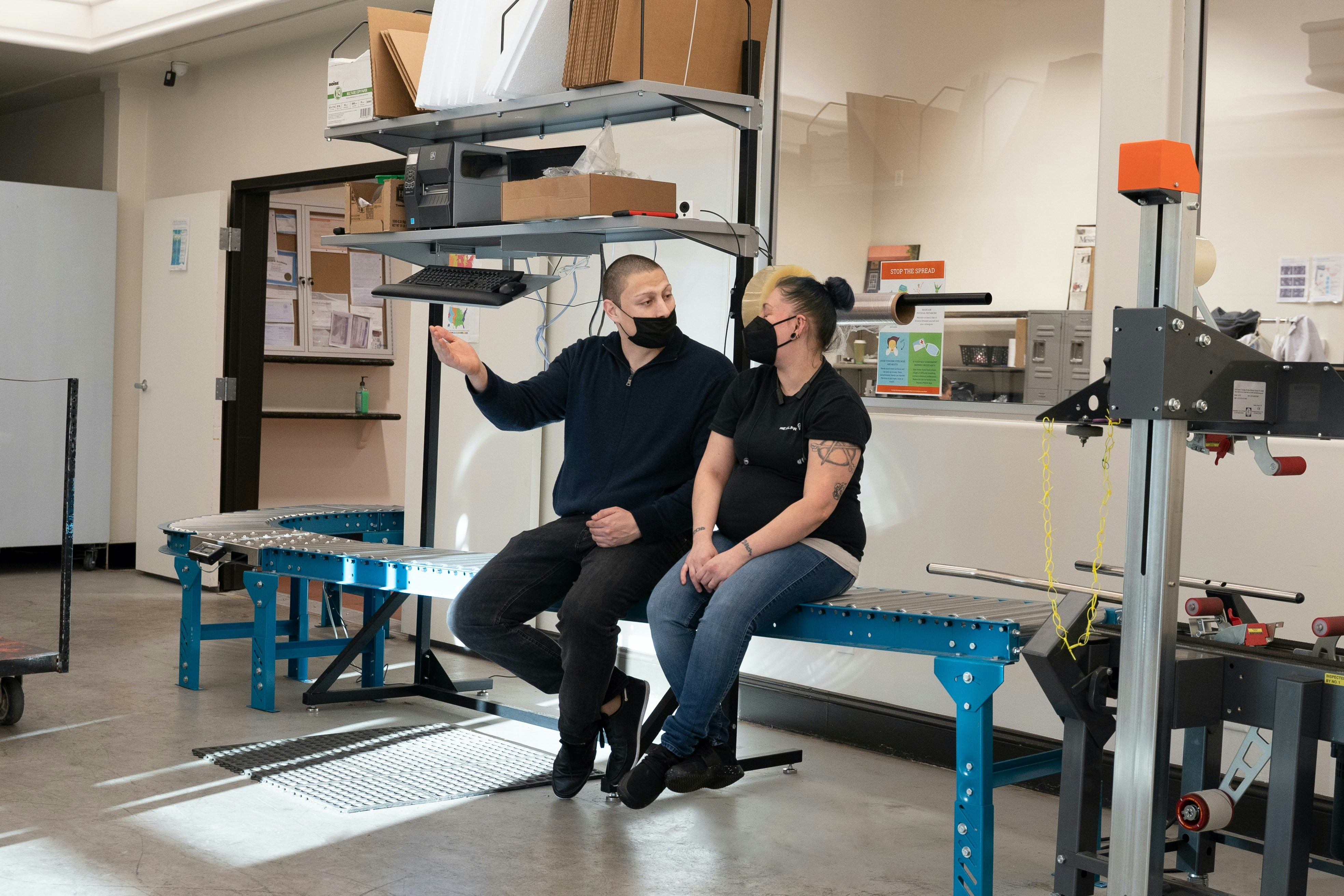 a man and a woman are sitting on a bench
