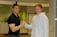 A happy client shaking hands with a Crawlbots marketing expert.