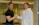 Smiling customer shaking hands with a professional cleaner in uniform.