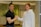 Close-up of a customer shaking hands with a service provider in a bright workspace.
