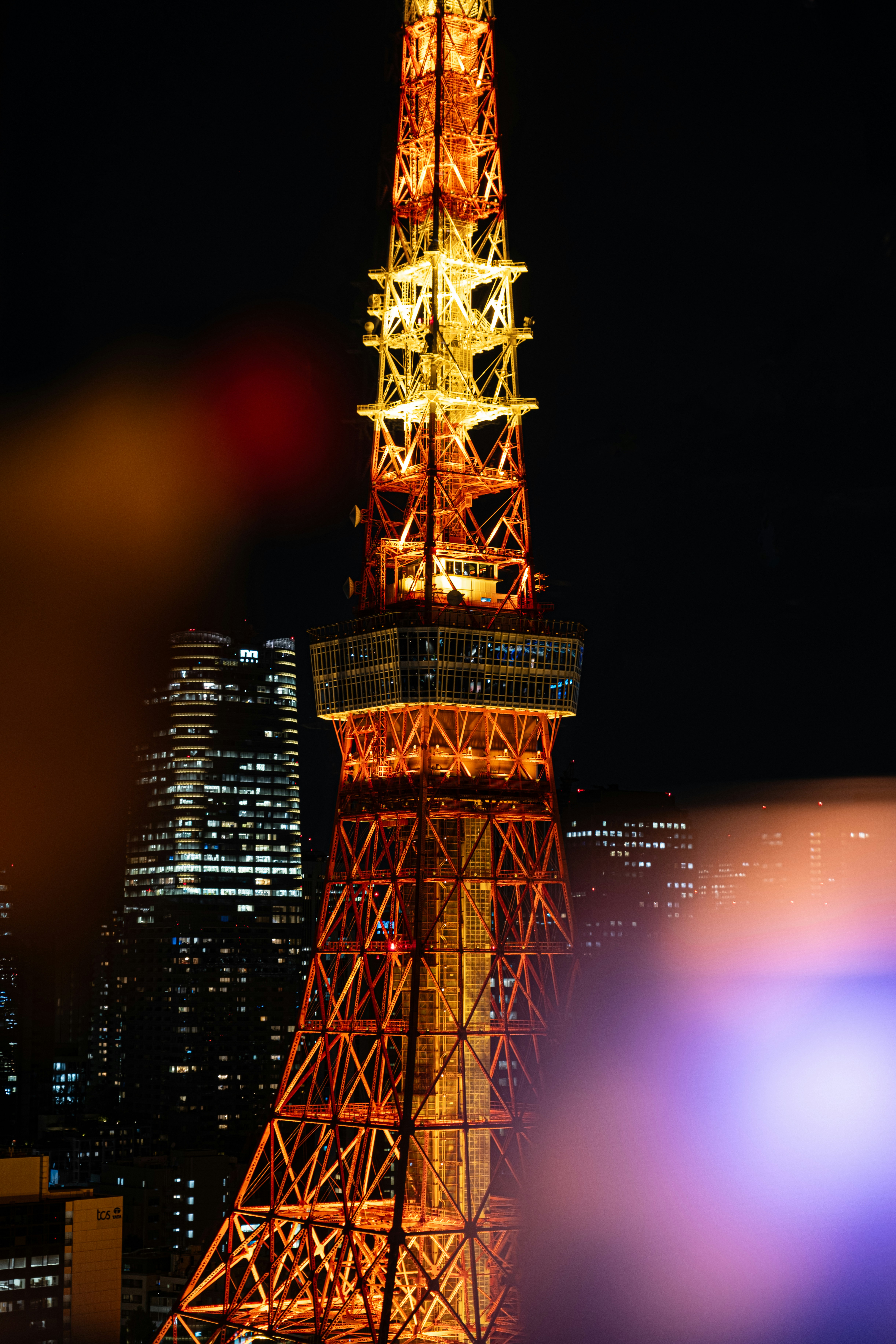 the eiffel tower is lit up at night