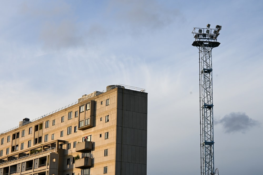 a tall tower next to a tall building