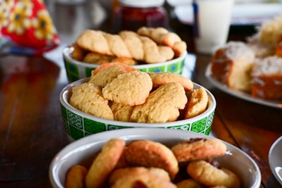 a close up of three bowls of food on a table