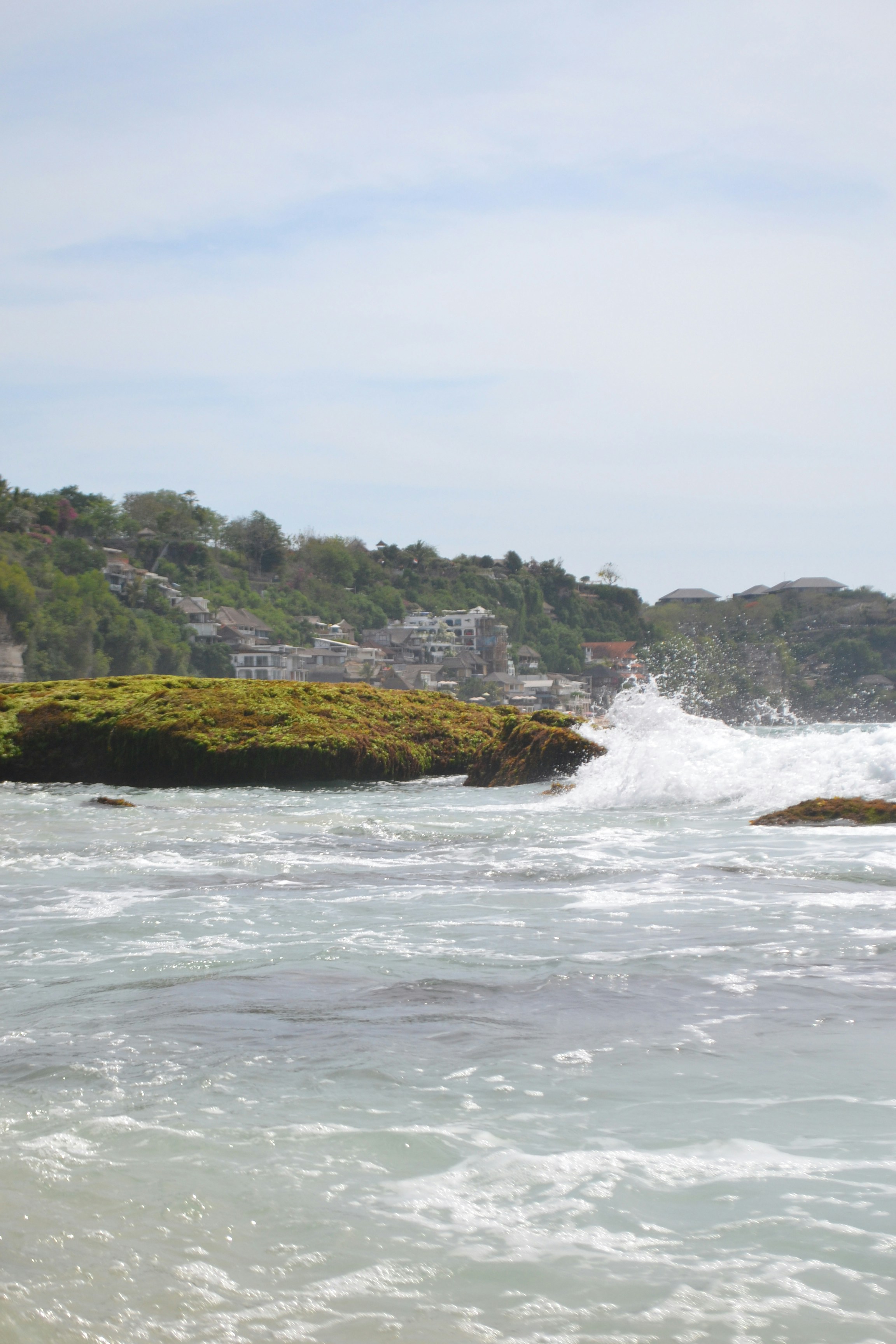 Dreamland Beach (New Kuta Beach) — Heavy Indian Ocean shorebreak wave pitching onto the sand shelf, creating Dreamland's famous surf amphitheater.