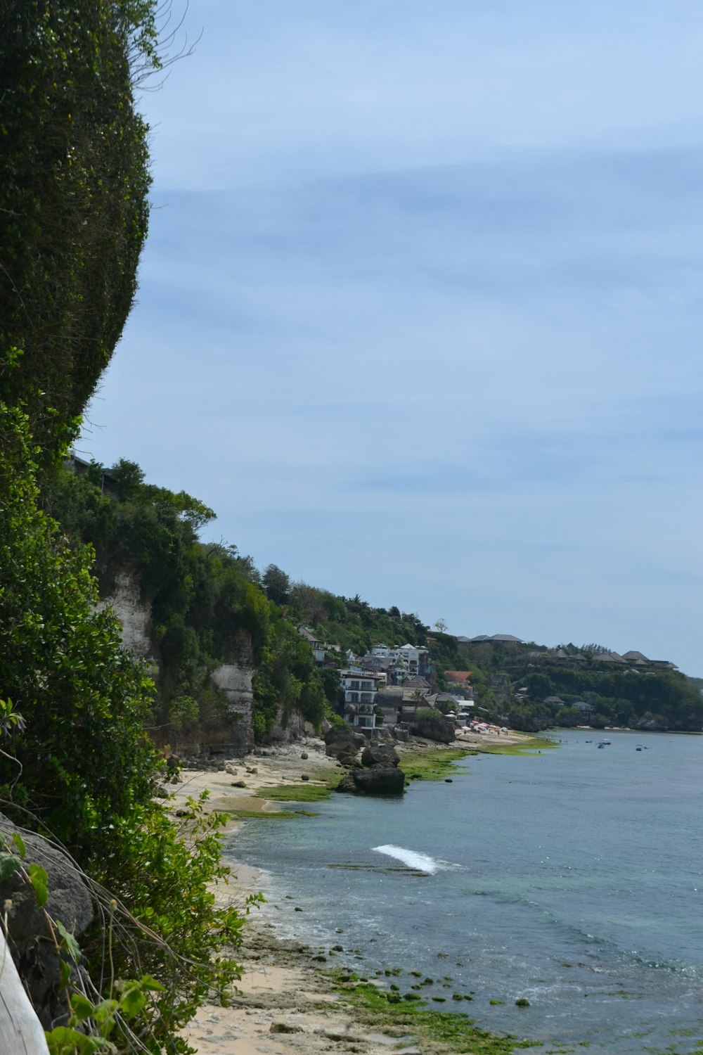 a view of a beach with a boat in the water