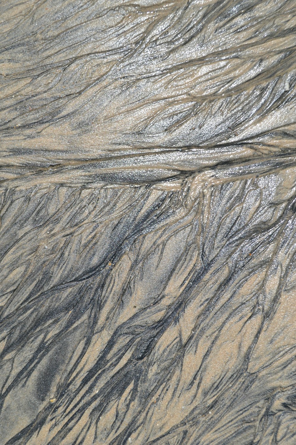 a close up view of the sand and water