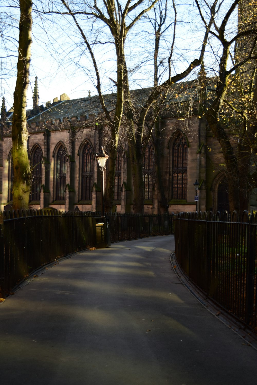 a long narrow road with a building in the background