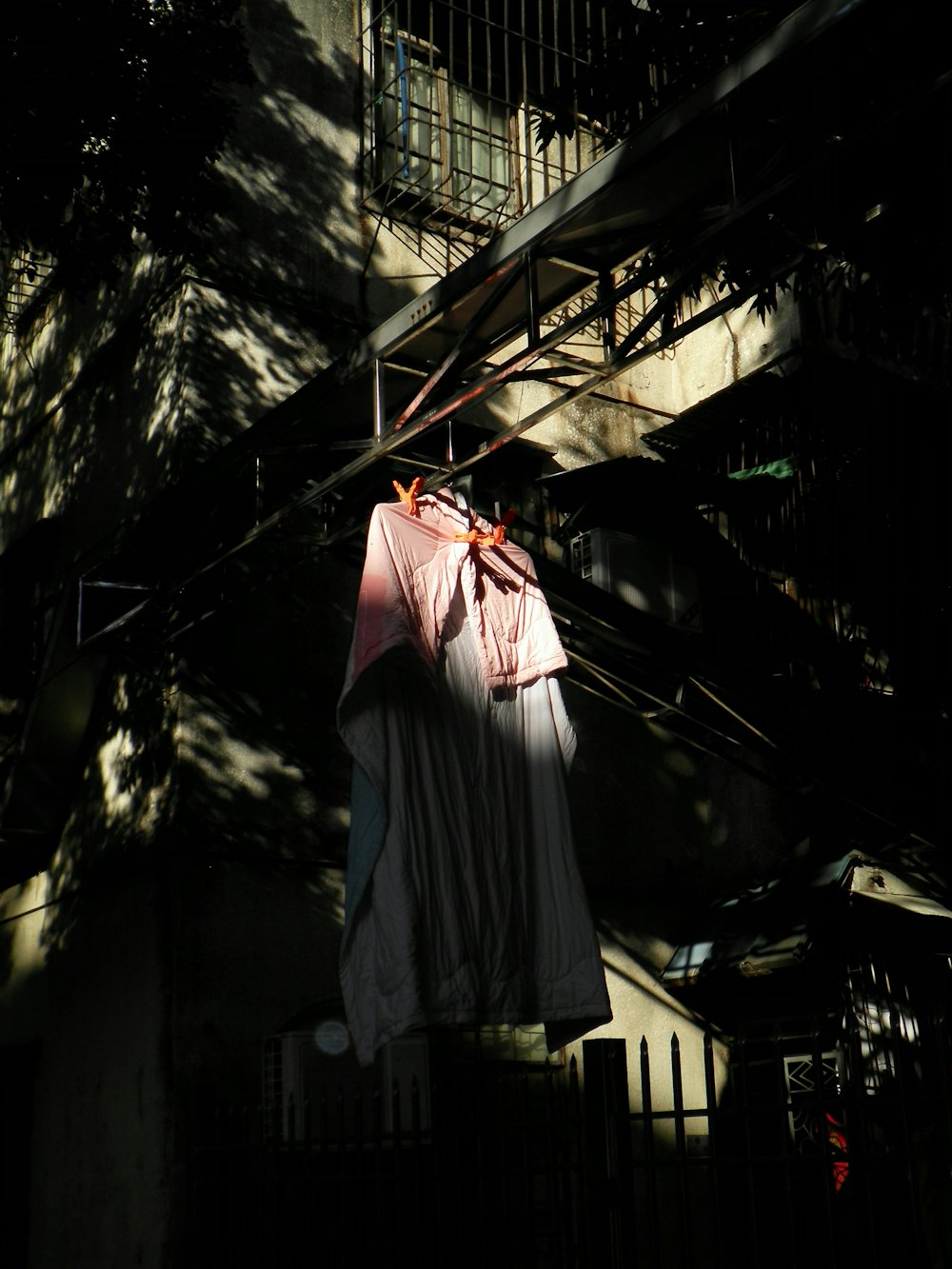 clothes hanging on a clothes line outside a building