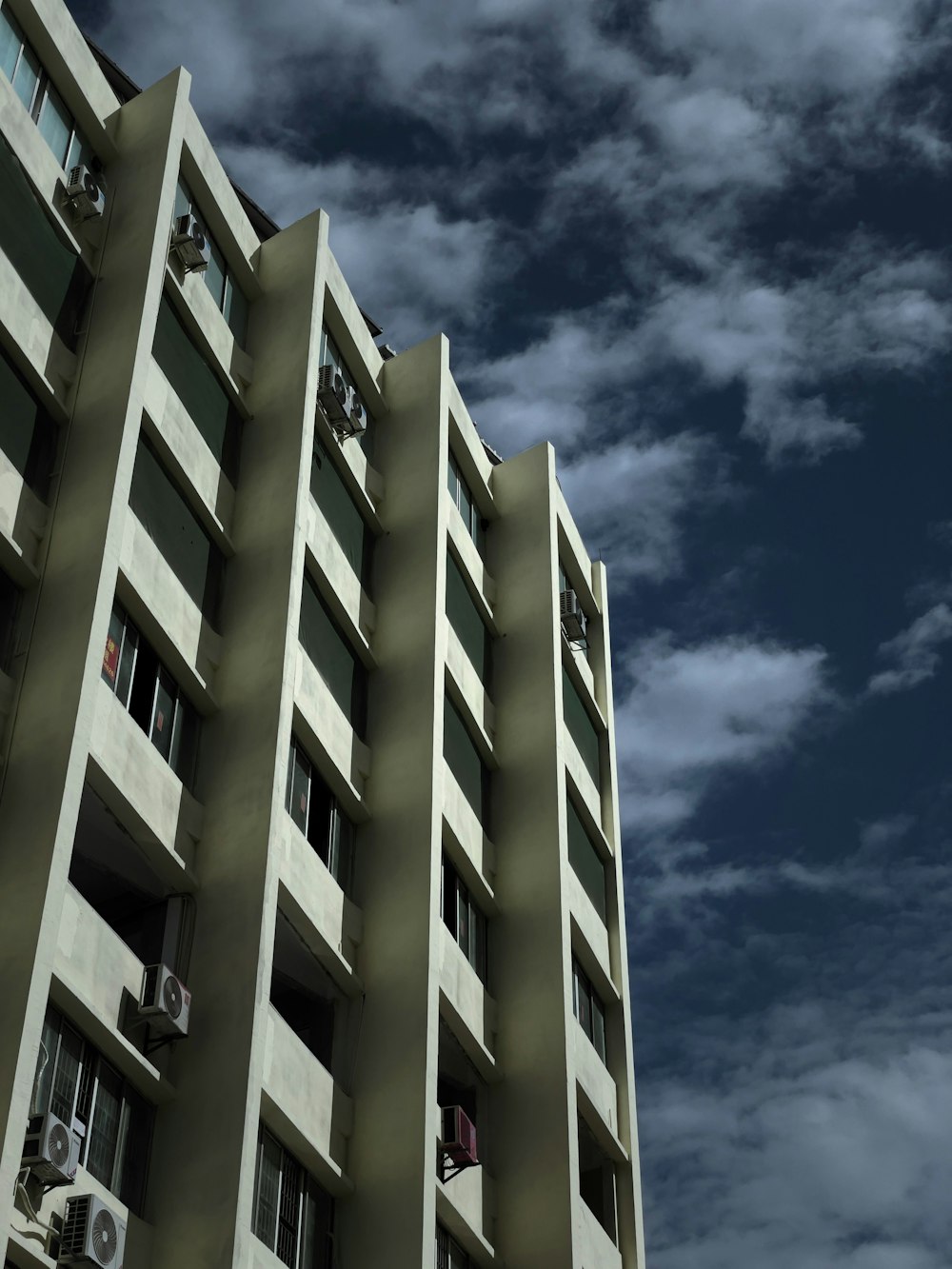 a tall building with a clock on the side of it