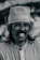 Portrait of an Indian man smiling confidently, wearing a natural-looking wig from toshmi.