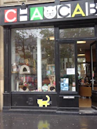 A cozy veterinary clinic reception area with pet products displayed