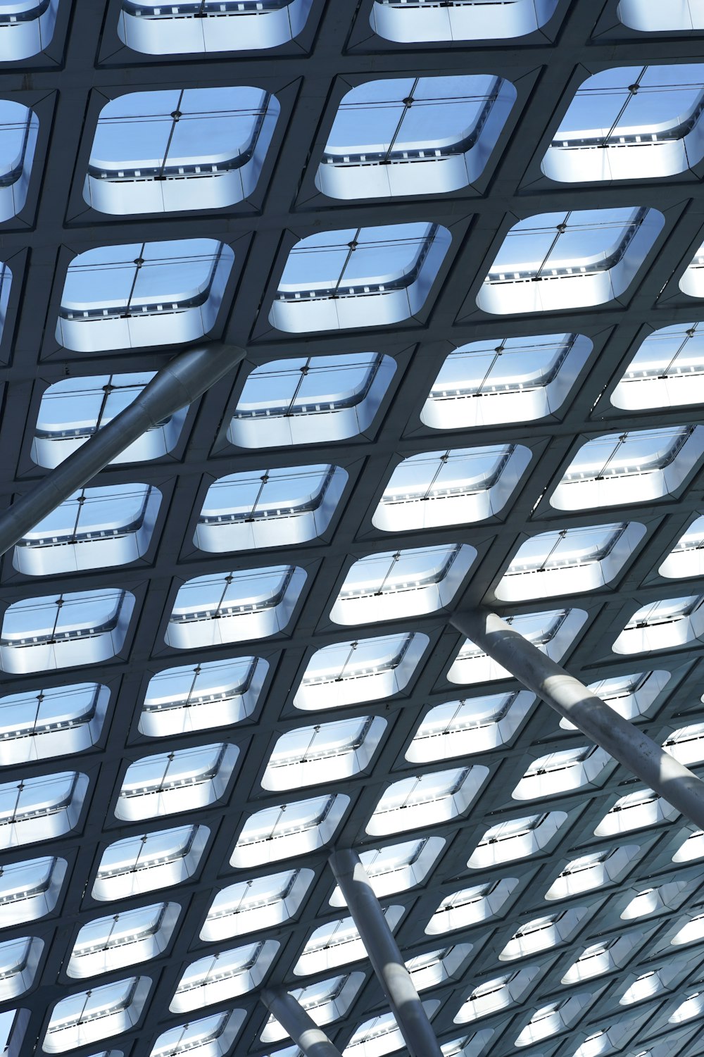 the ceiling of a train station with lots of windows