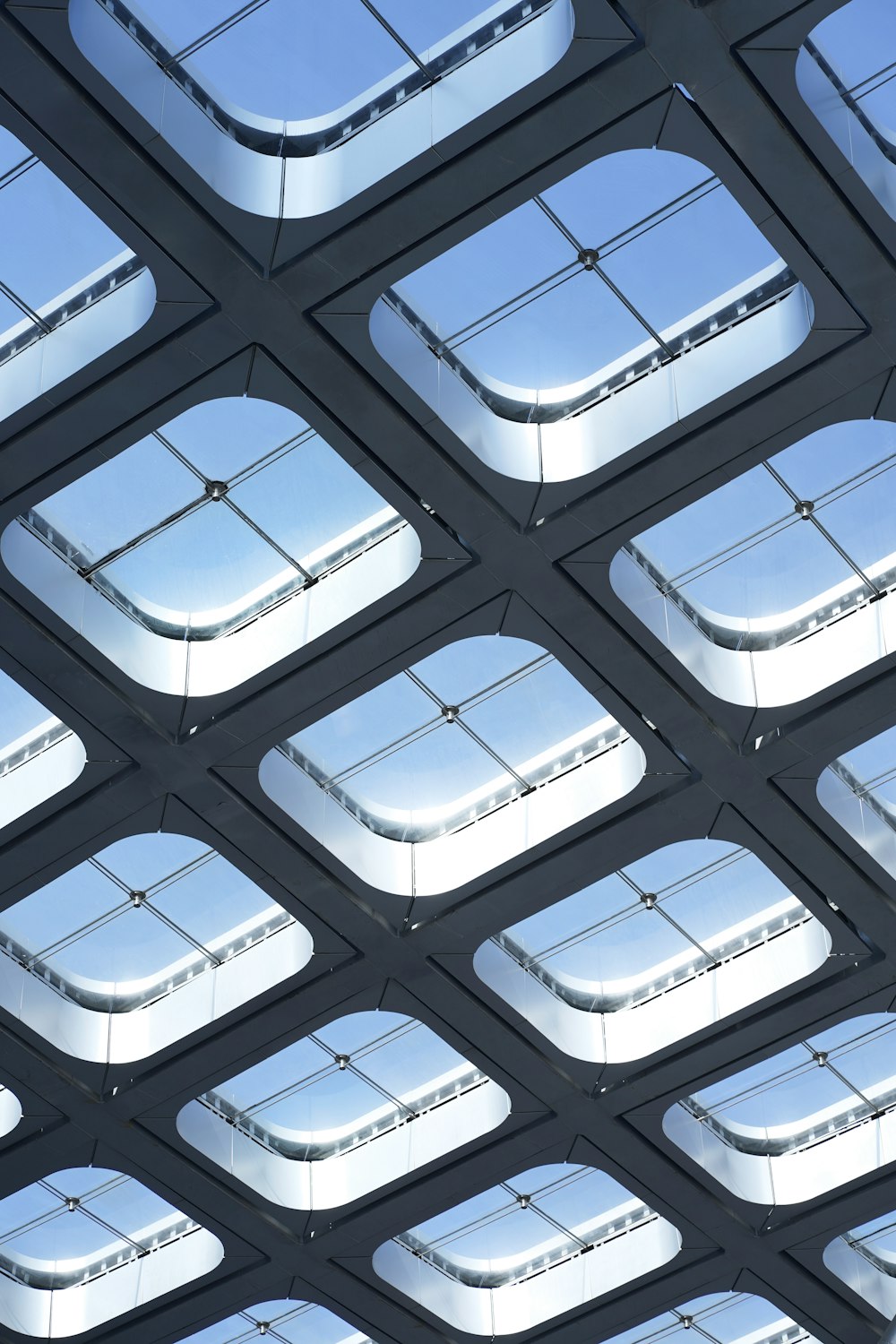 the ceiling of a train station with many square windows