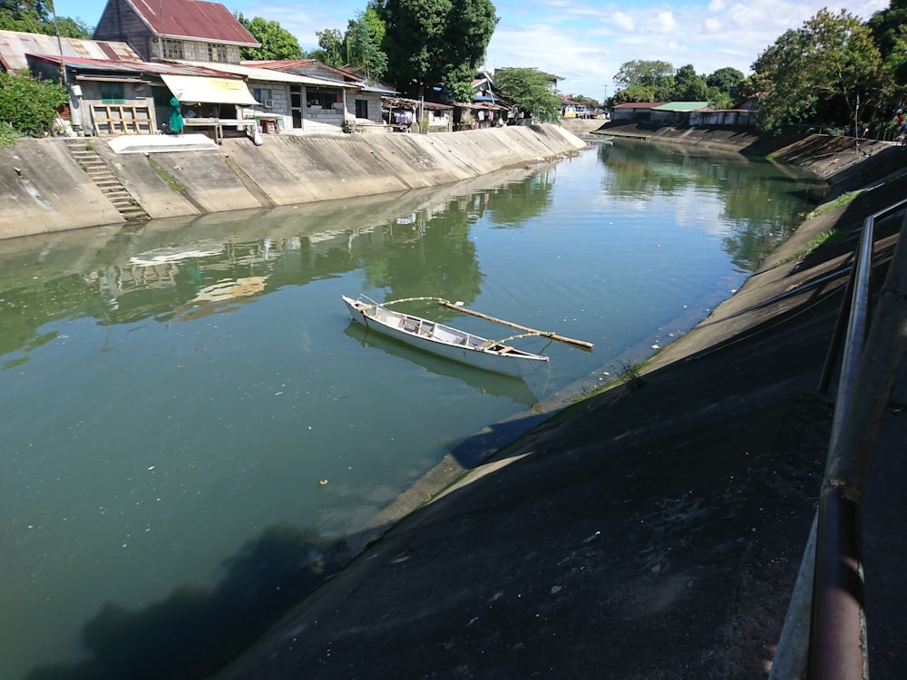 a small boat floating on top of a river