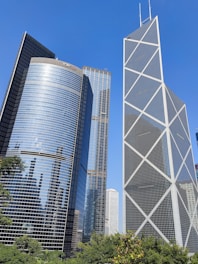 a couple of tall buildings sitting next to each other