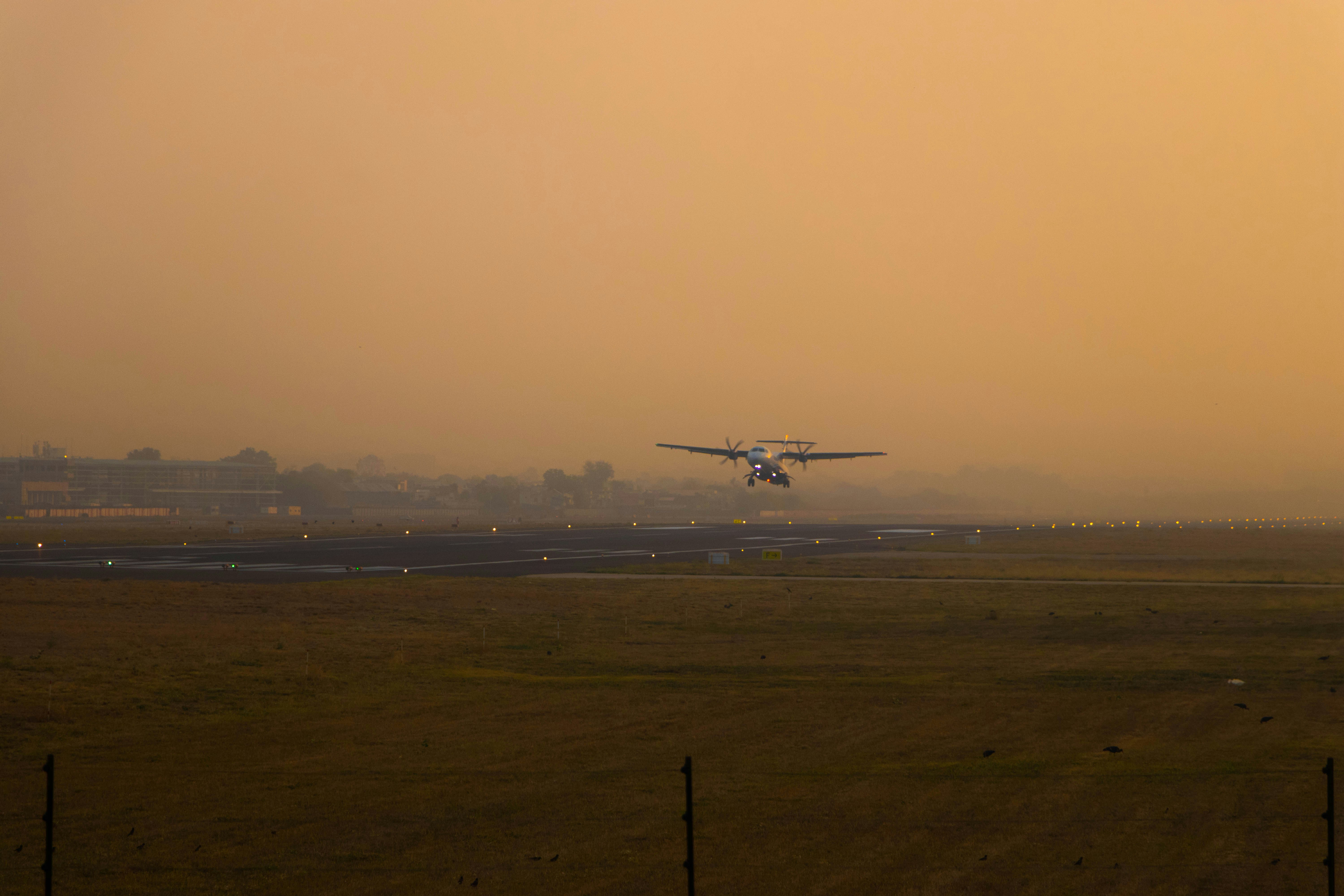 a plane taking off from an airport runway