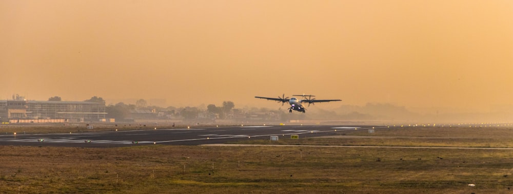 an airplane is taking off from an airport runway