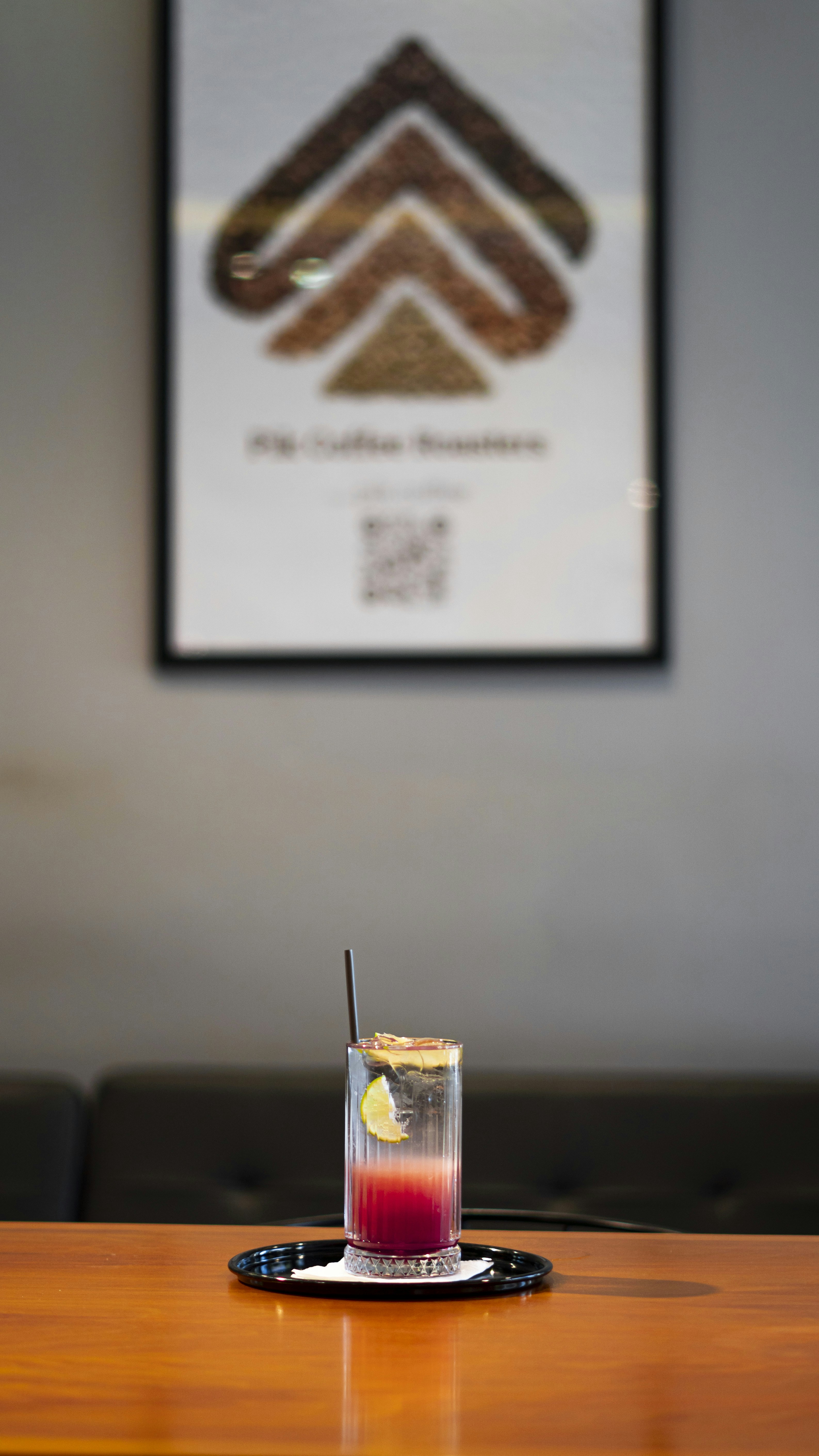 a drink sitting on top of a wooden table