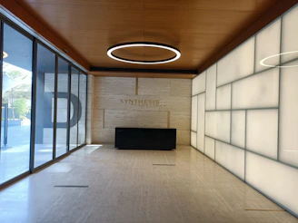A sleek, dark-toned workspace with a glowing diamond-shaped light accent, symbolizing transformation and clarity.