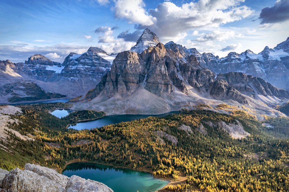 a mountain range with a lake in the foreground