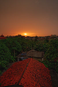 Sunset view over a lot with gentle slopes and natural vegetation.
