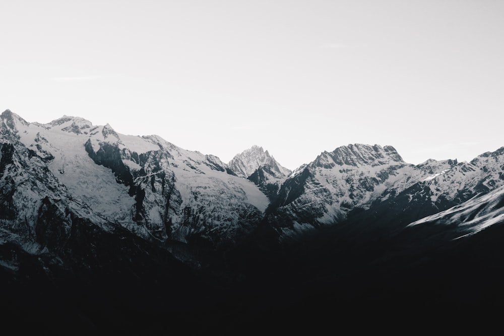 a black and white photo of a mountain range