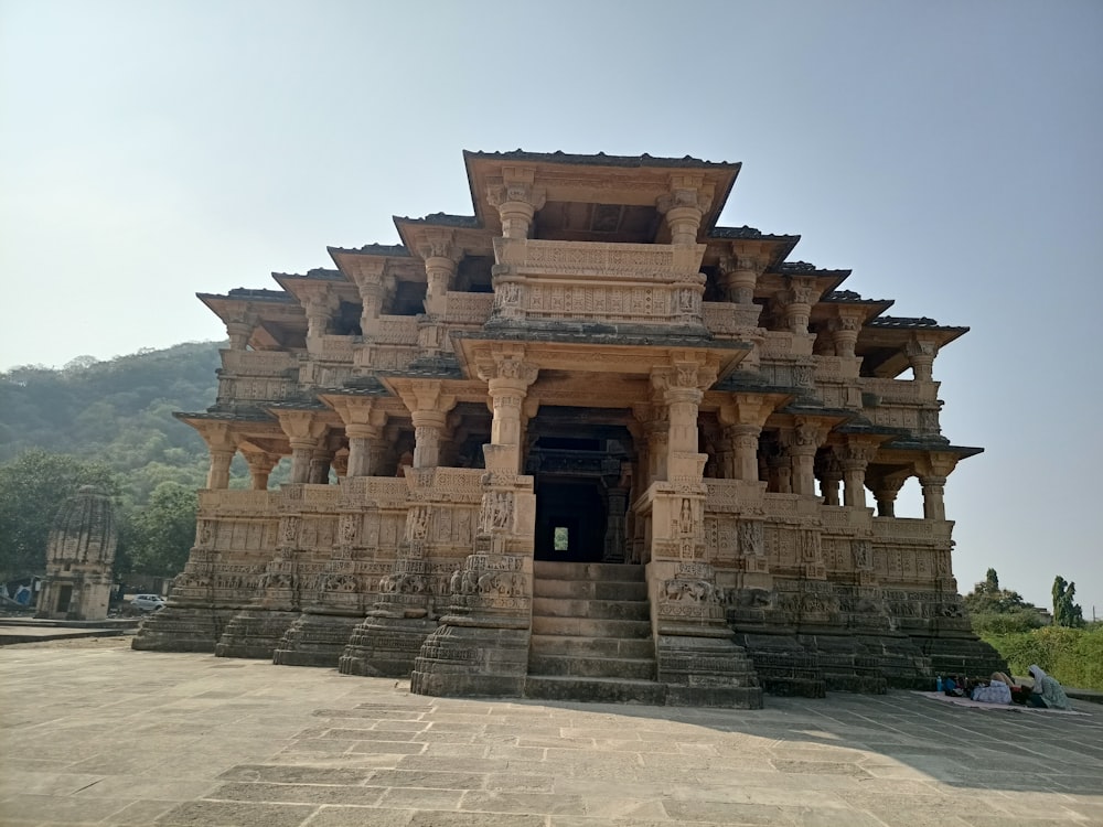 a large stone structure with pillars and steps