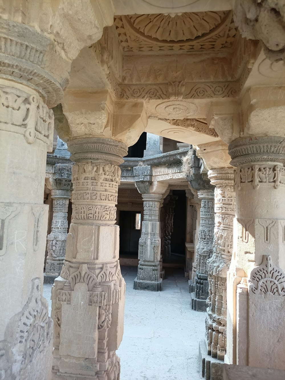 a group of stone pillars with carvings on them