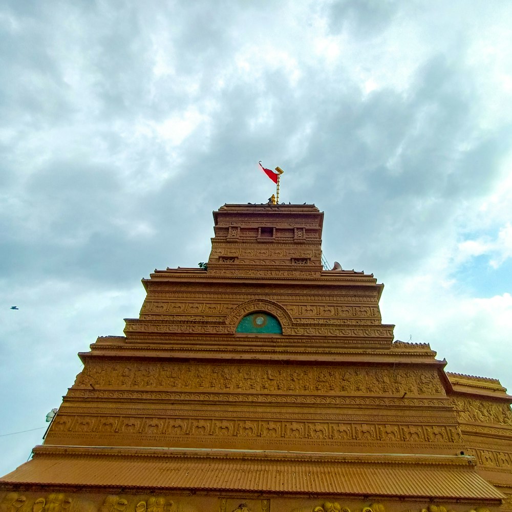 a tall building with a flag on top of it