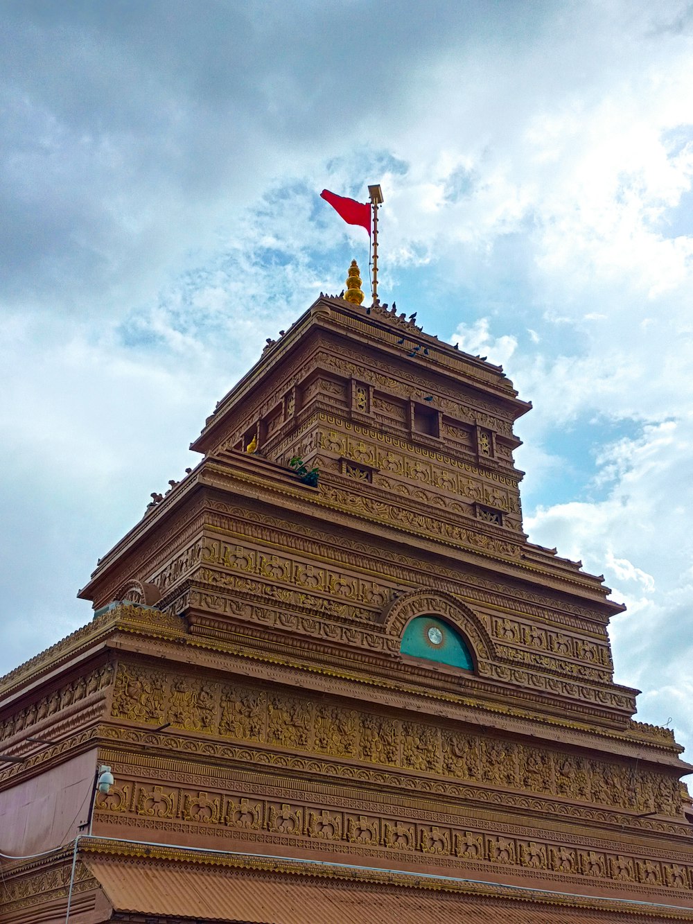 a tall tower with a flag on top of it