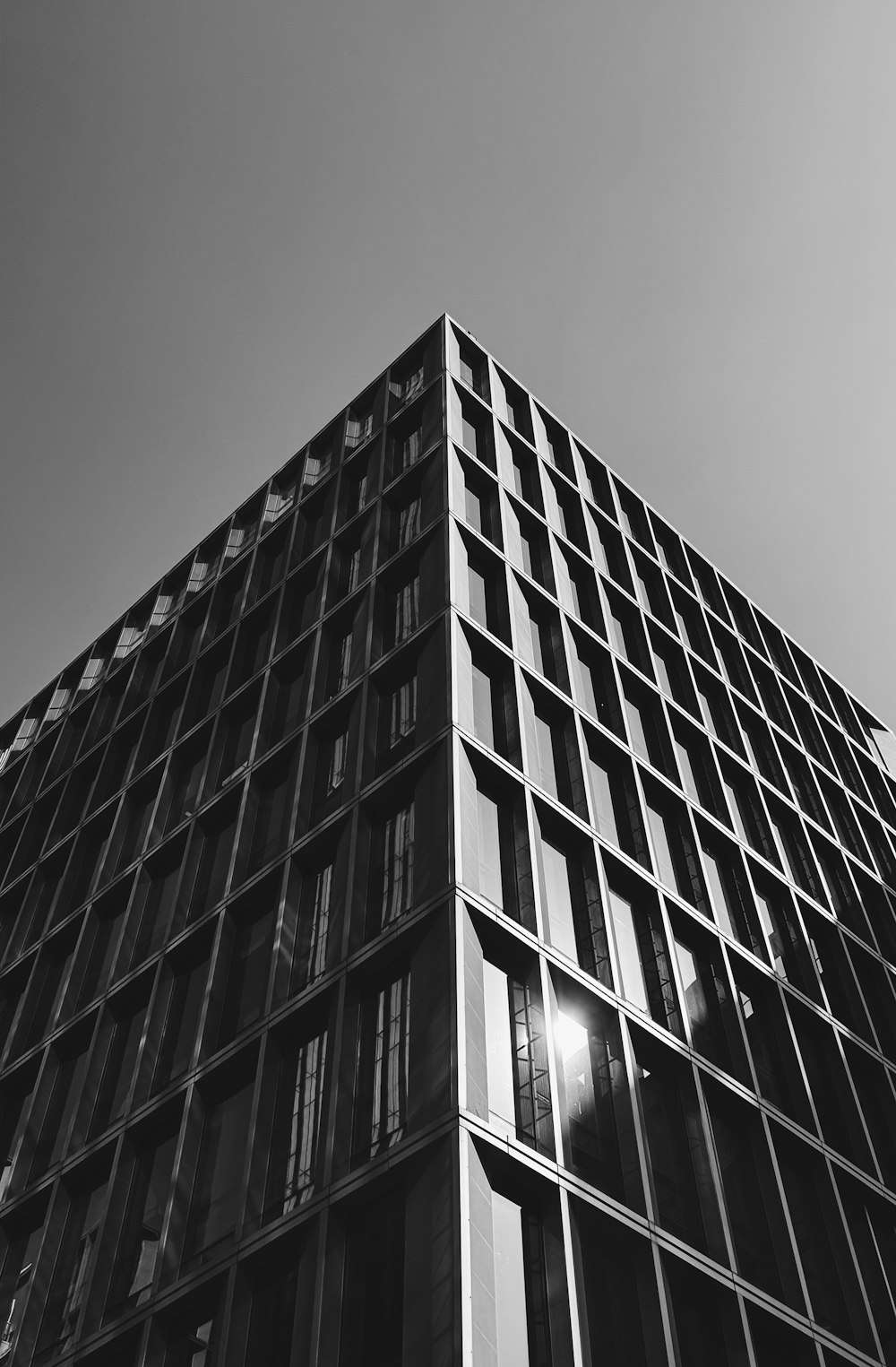 a black and white photo of a tall building